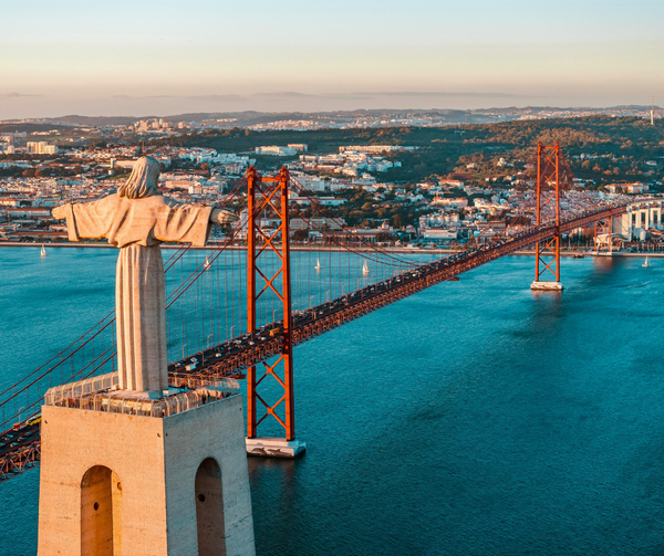 Lisbon Bridge and the Statue of Christ over river Tagus