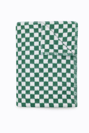 Folded green and white checkered blanket
