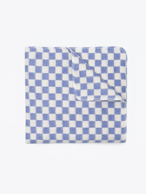 Checkered blue and white blanket folded on white background