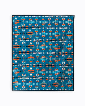 Blue background with a cross made out of celtic mother child symbols with orange and while and light blue stripes in a repeat pattern