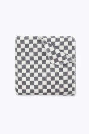 Folded grey and white checkers blanket