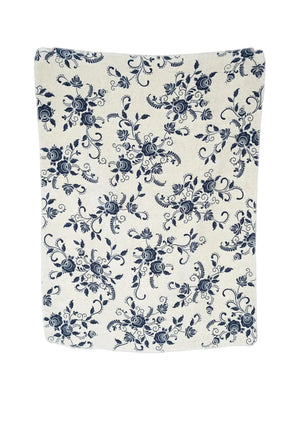 A rectangular cream-colored blanket or throw, featuring an all-over navy blue floral and scroll pattern, shown against a plain white background.